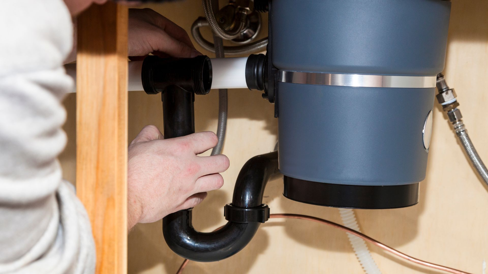 A person is working on an electrical outlet